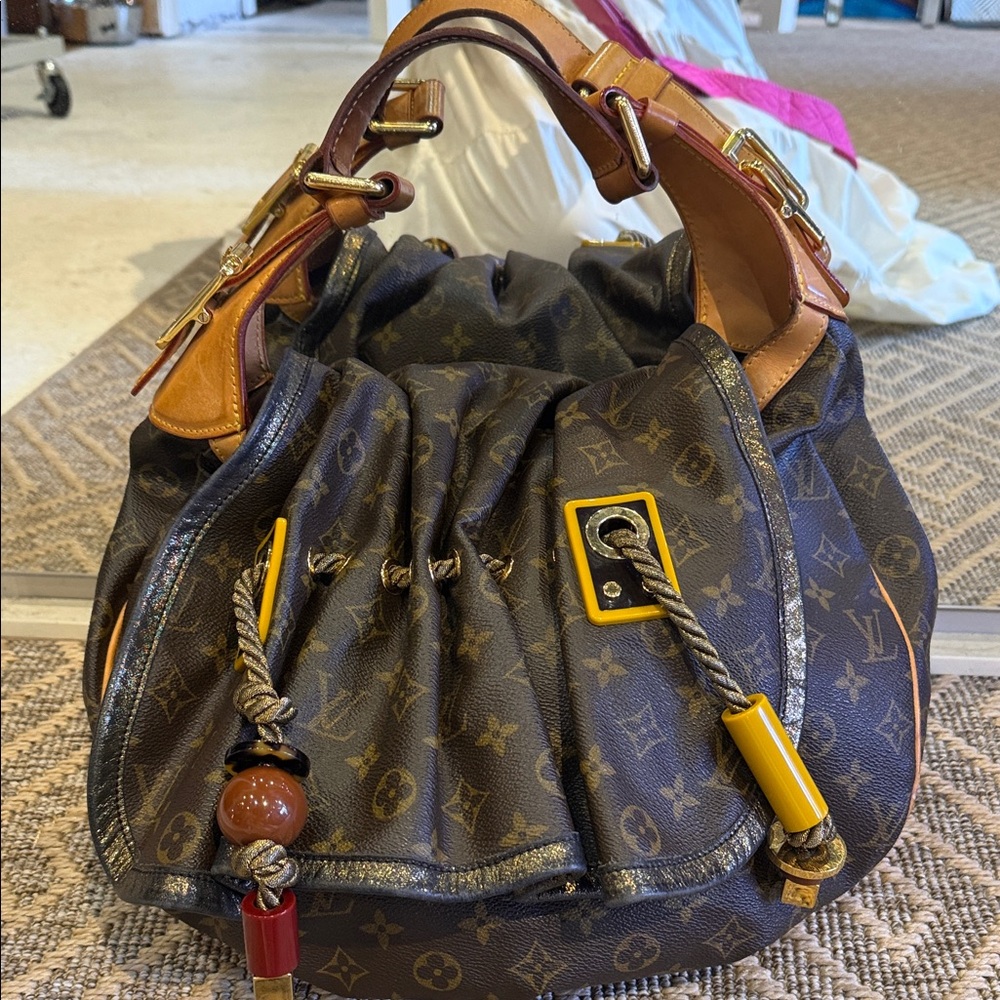 Louis Vuitton Brown Monogram Drawstring Shoulder Bag circa 2009